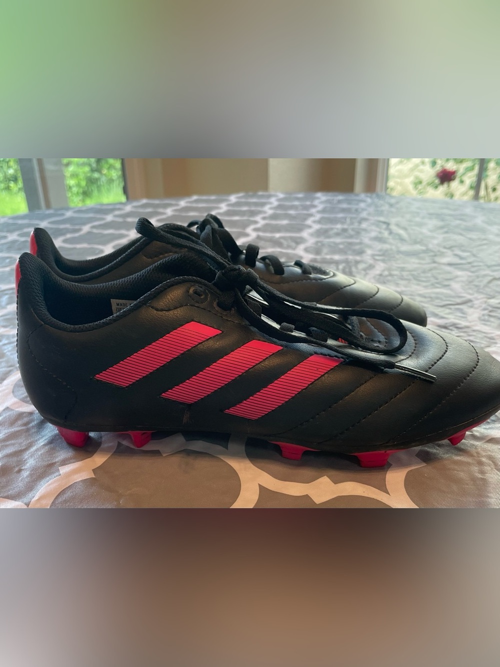 Adidas Goletto VII firm ground soccer cleats in a black and pink size 5